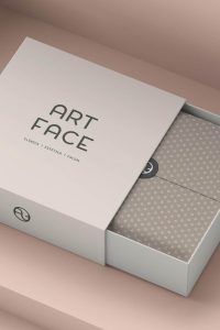 Caja de presentación con branding de Art Face y papel personalizado en su interior.
